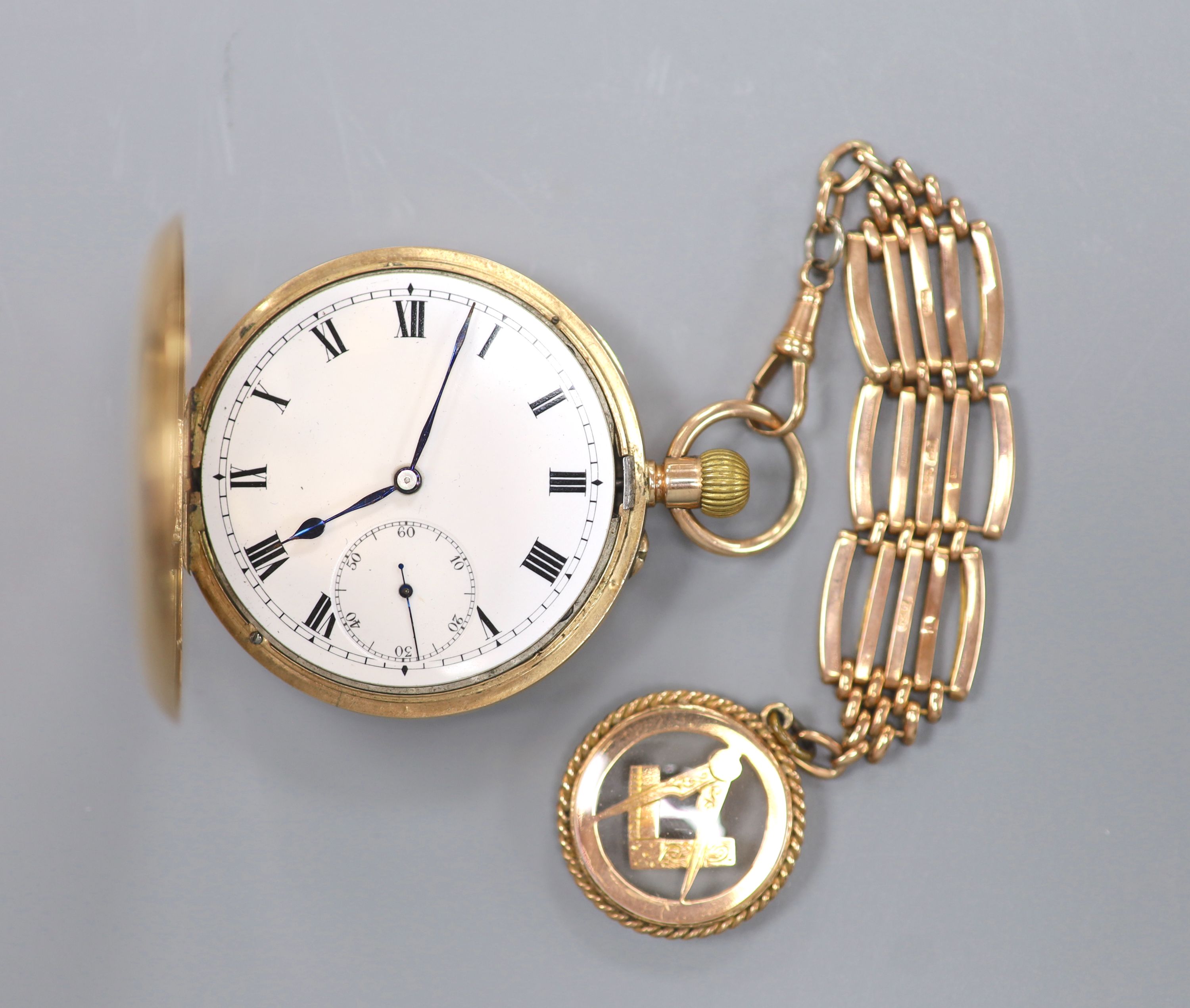 A 20th century 9ct gold hunter keyless pocket watch, on a 9ct gold chain with masonic charm